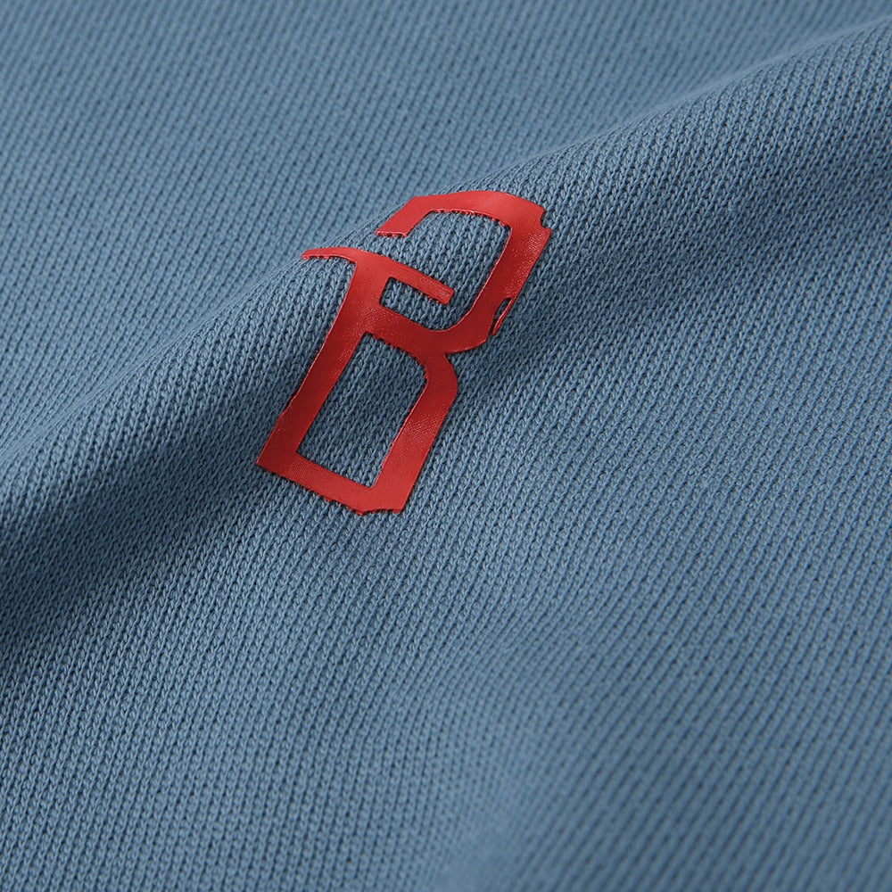 هودي أزرق مطبوع "Not Here Yet" مع غطاء رأس